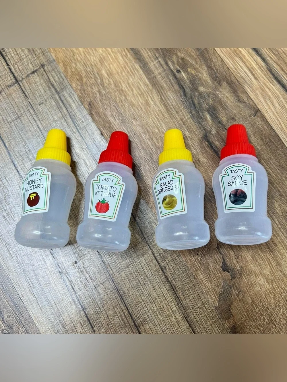 4 Piece Mini Portable Condiment Bottles - Perfect For On-the-Go Travelers
